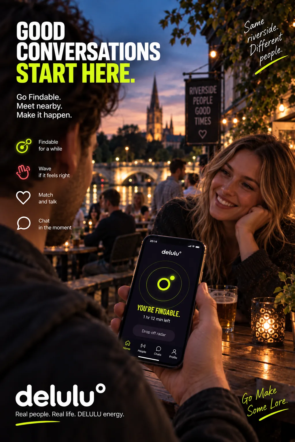 A poster. Two people talking at a riverside table at dusk, one holding a phone showing the DELULU home screen with the findable ring and “1 hr 12 min left”. The headline reads “Good conversations start here.”